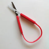 Ciseaux à ressorts rouge de 20cm pour adultes